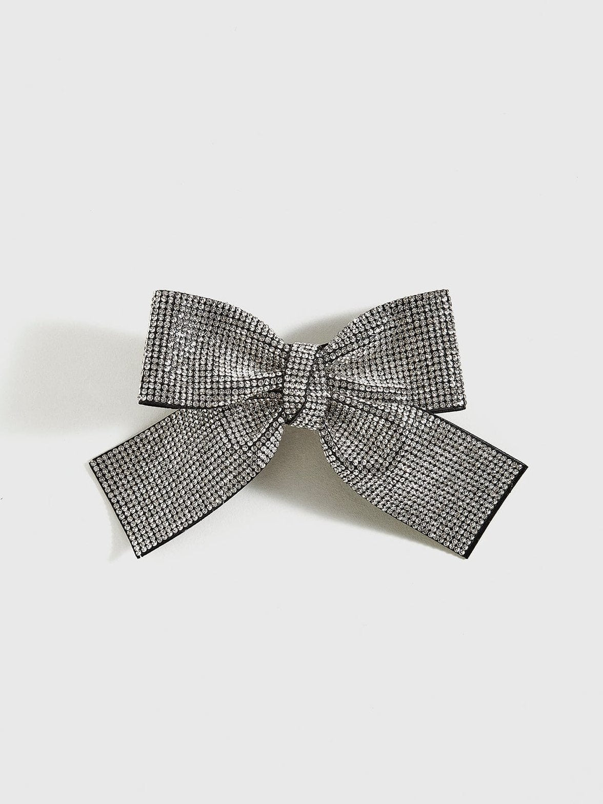 Barrette nœud papillon strass argentée douceur