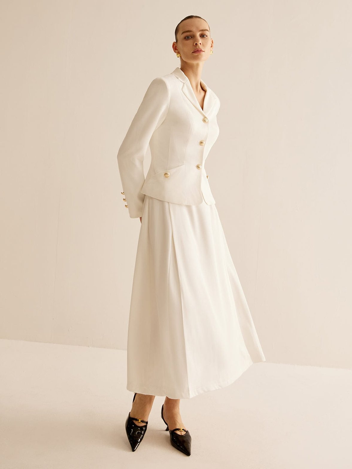 Blazer blanc vue rapprochée émeraude