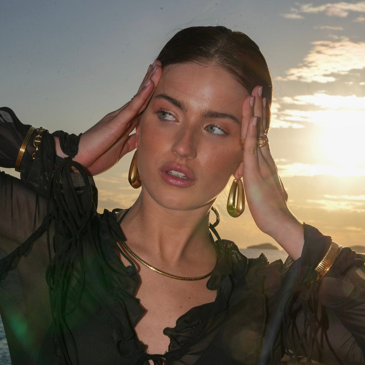 Boucles d'oreilles dorées au coucher de soleil zephyr