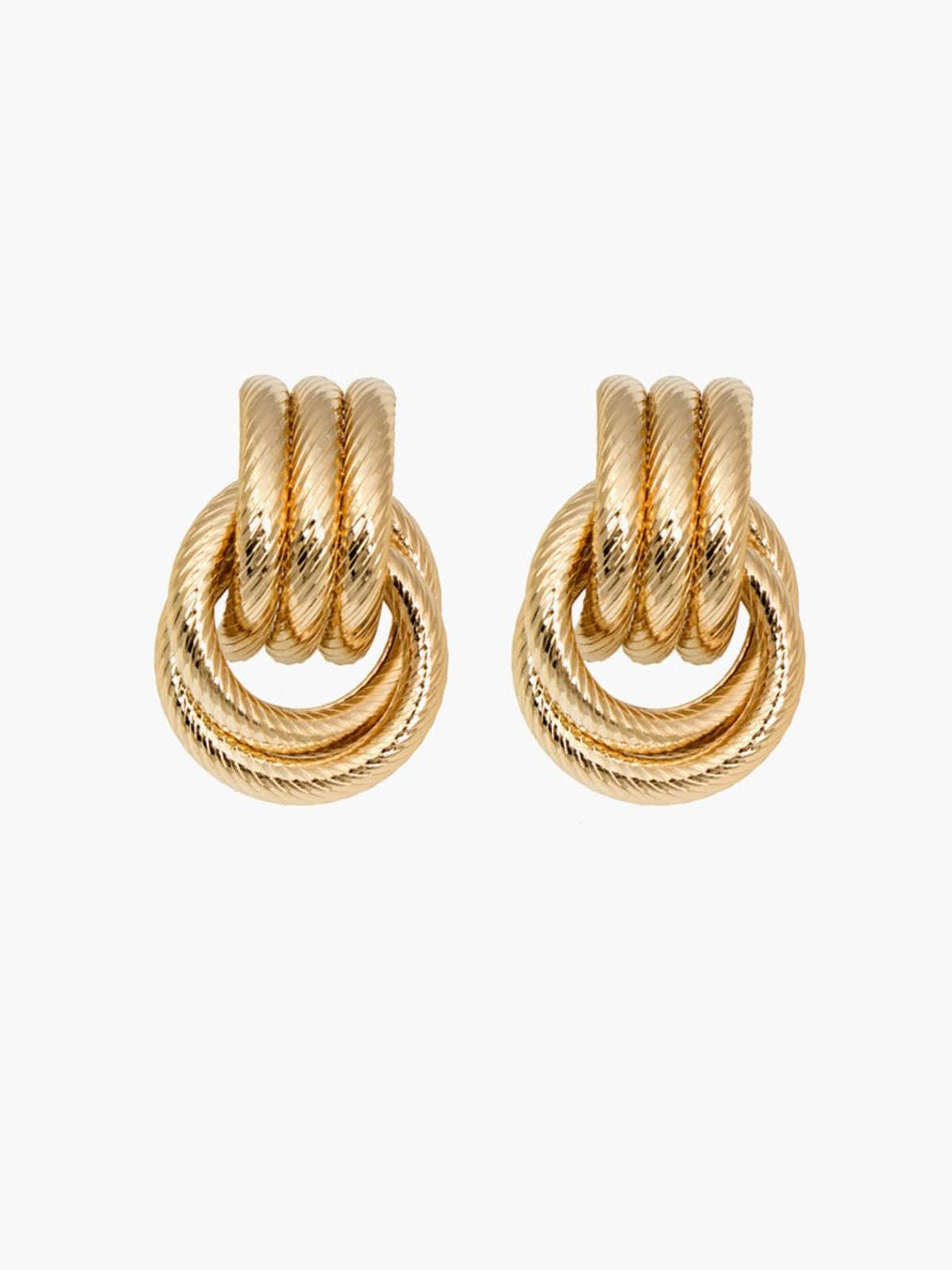Boucles d'oreilles torsadées dorées vue détaillée velours