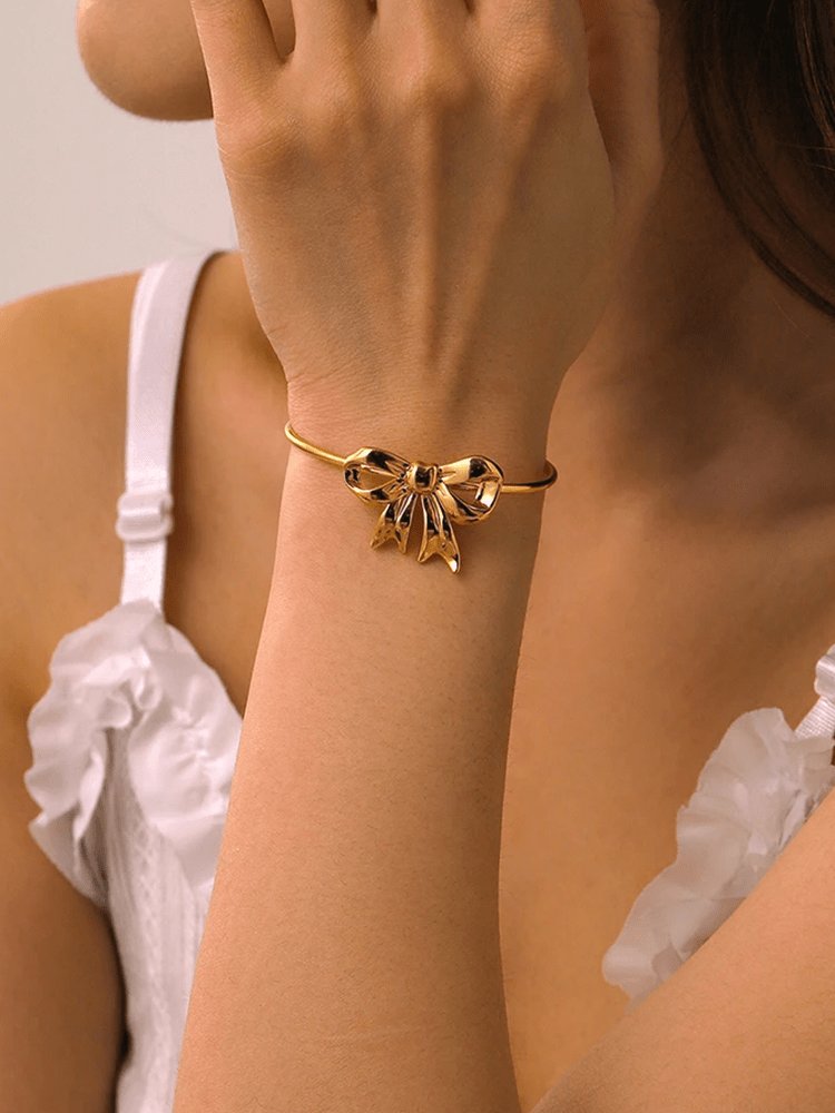 Bracelet jonc doré nœud papillon élégant douceur