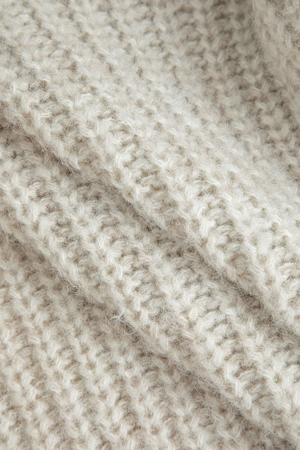 Détail des poches en denim du cardigan océan