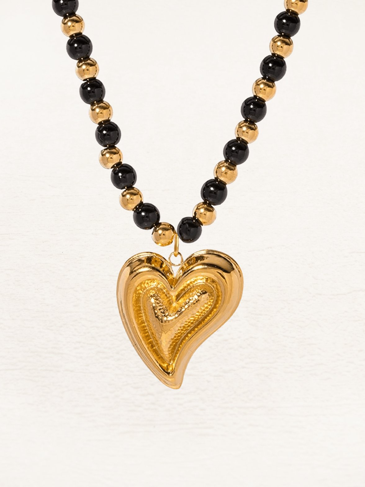 Collier agate noire et pendentif coeur doré sublime
