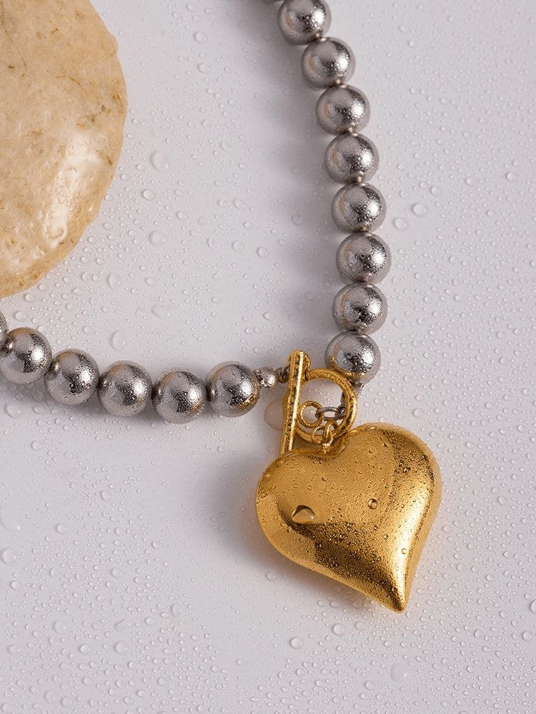 Collier perles et cœur glamour