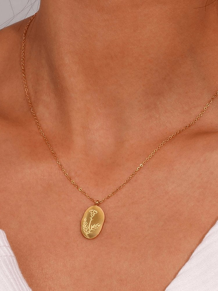 Médaillon ovale floral plaqué or harmonie