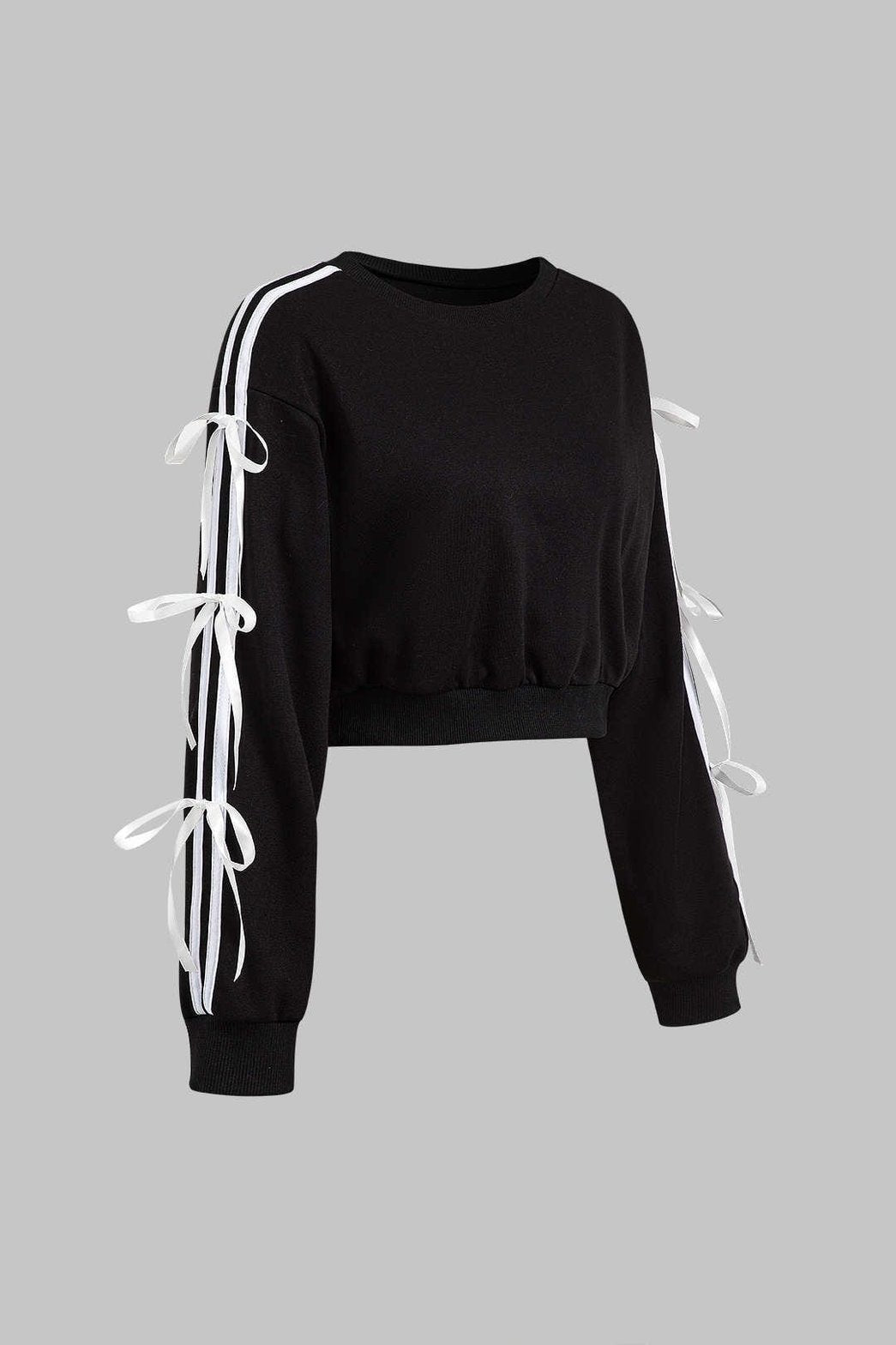 Détail des nœuds blancs sur manche noire gracieux