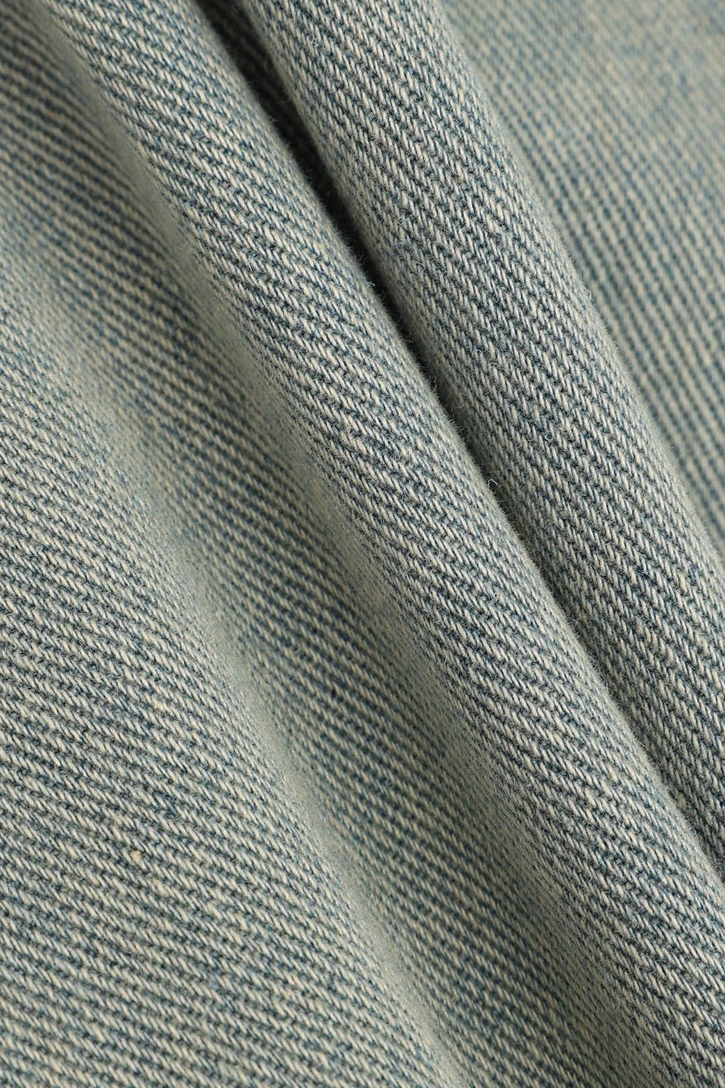 Détail des poches du jean pluie