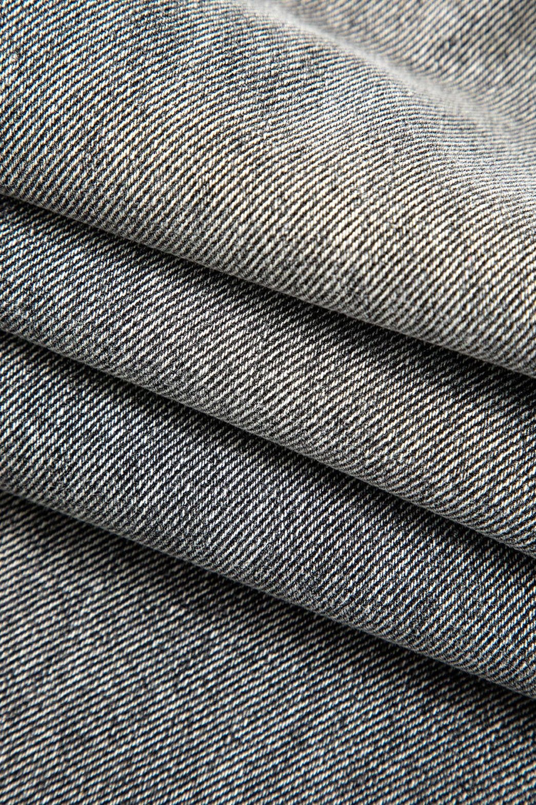 Jean asymétrique détail bouton passion