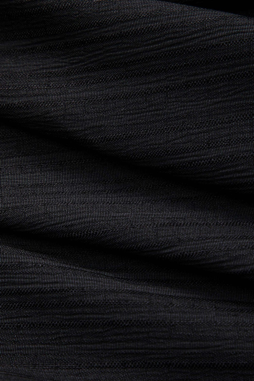 Jupe denim patchwork asymétrique détail finition cristal