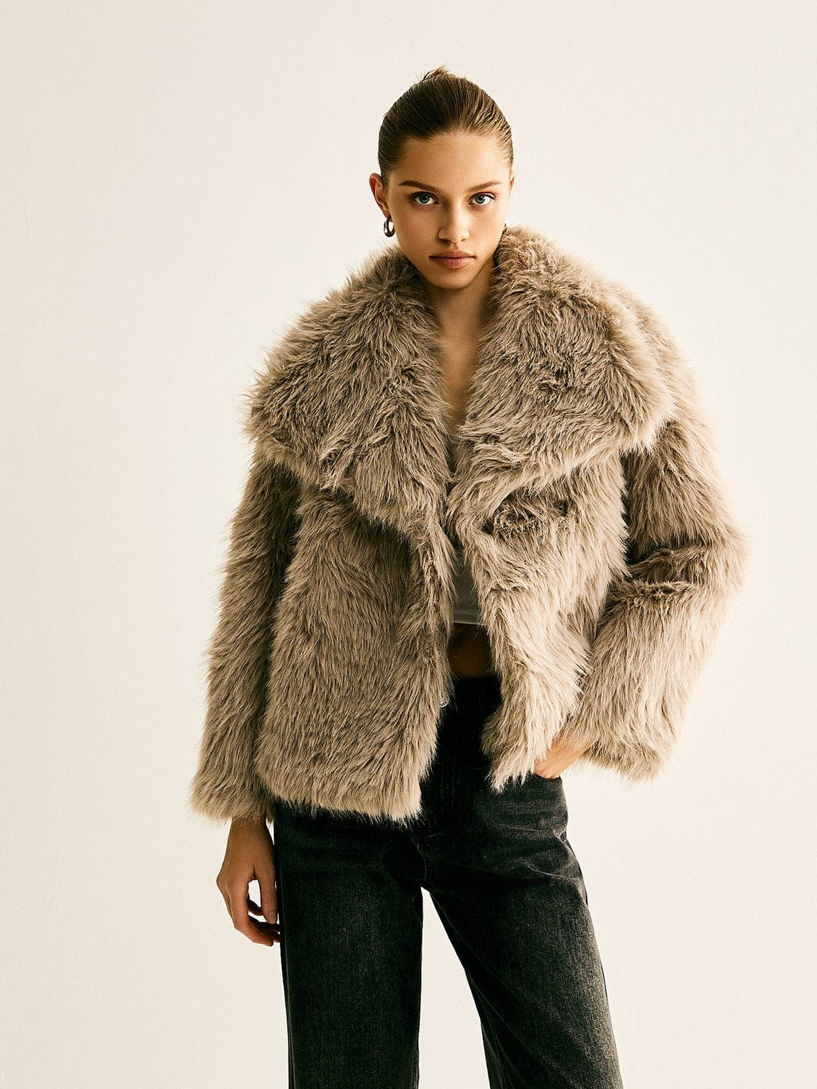 Manteau fausse fourrure poches soyeux