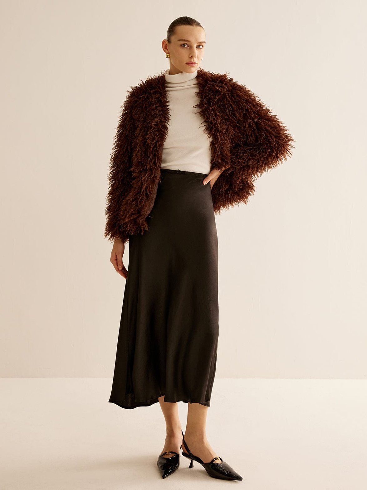 Manteau fausse fourrure marron détail texture chaleur