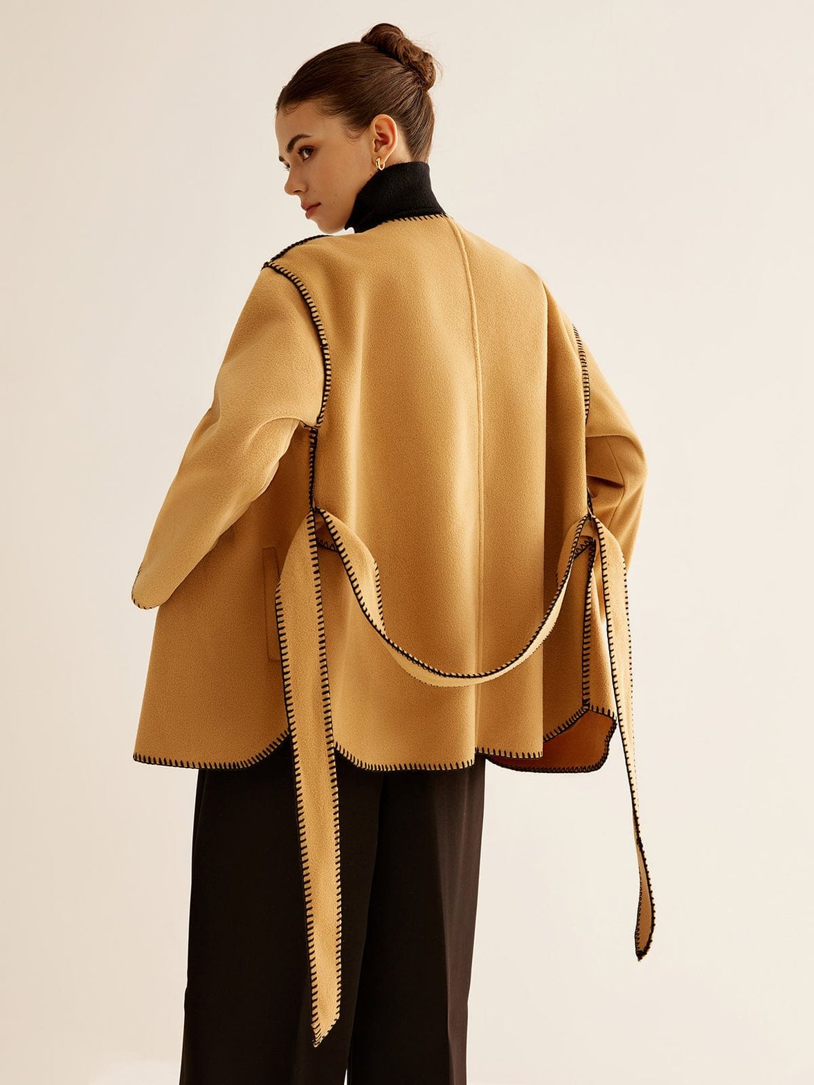 Détail de la matière tweed et finitions raffiné