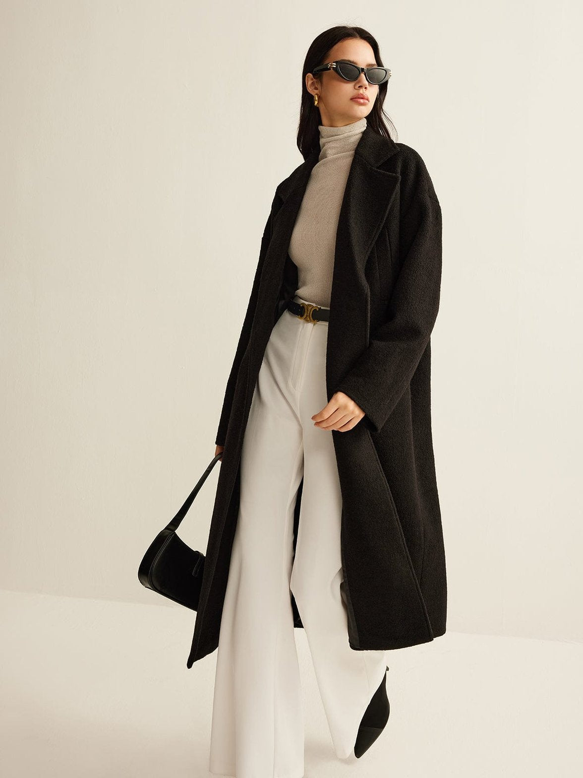Détail texture manteau tweed noir étoile