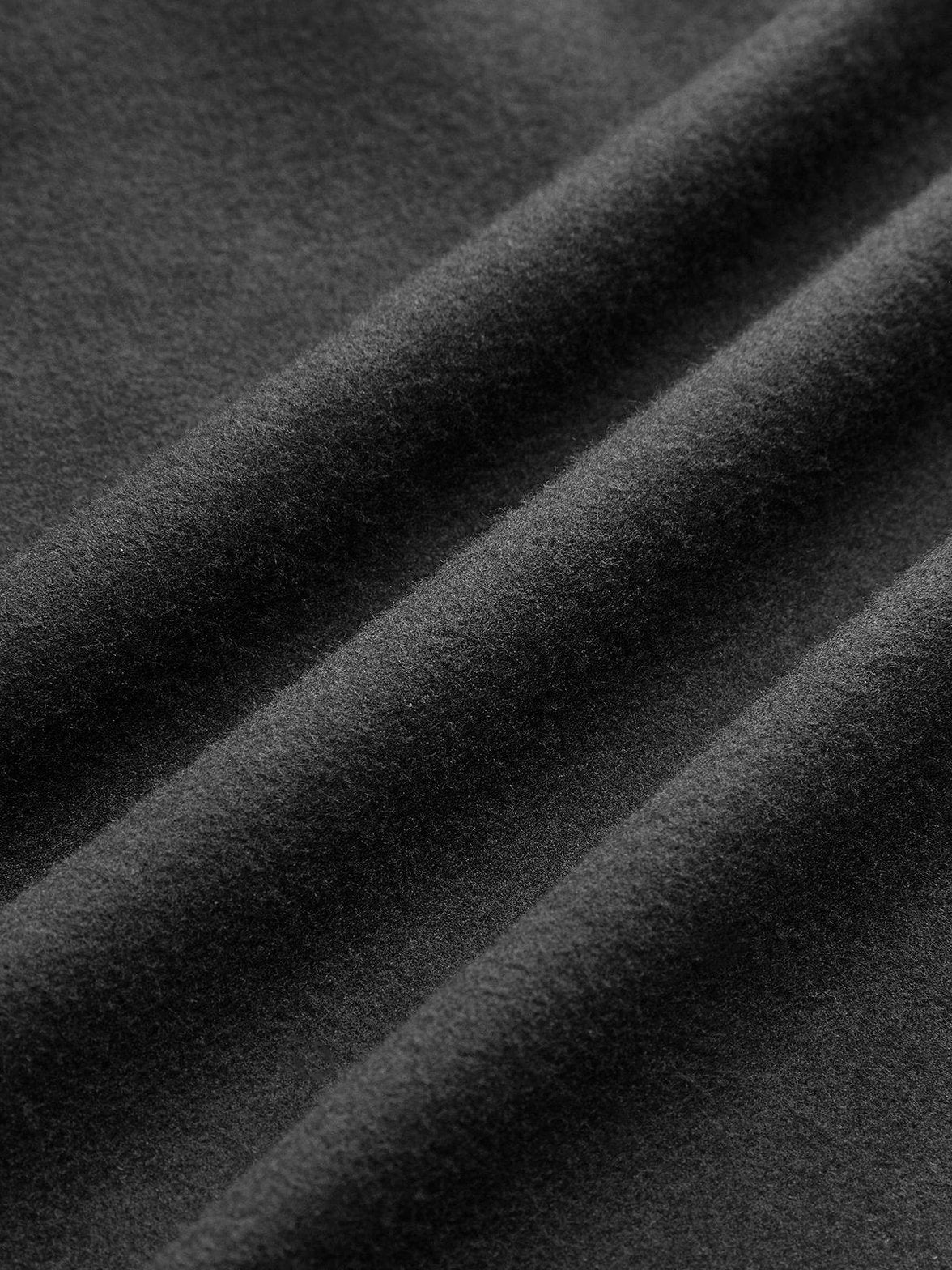 Manteau tweed noir vue de profil finitions soignées légèreté