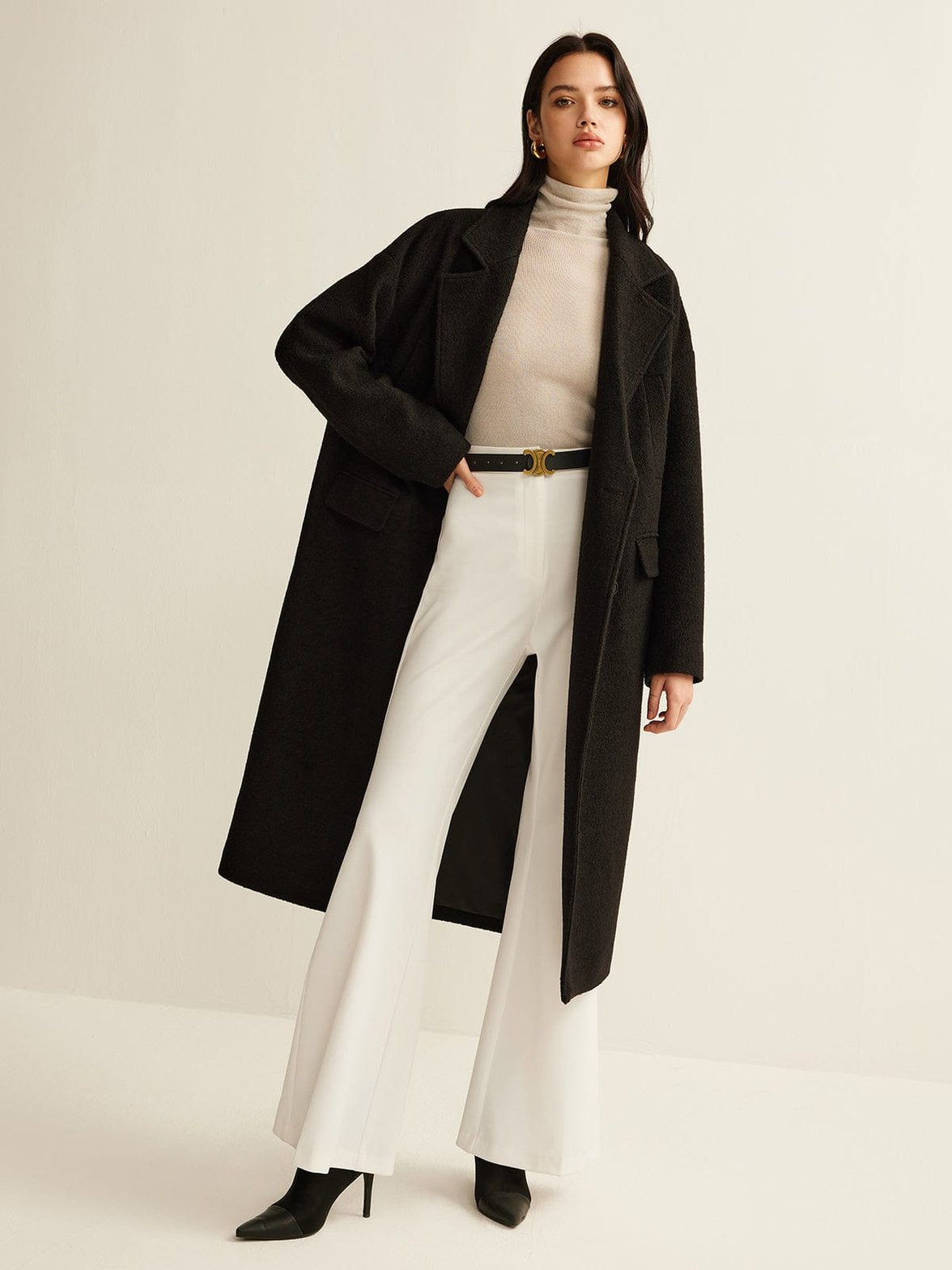Manteau tweed noir coupe ample vent