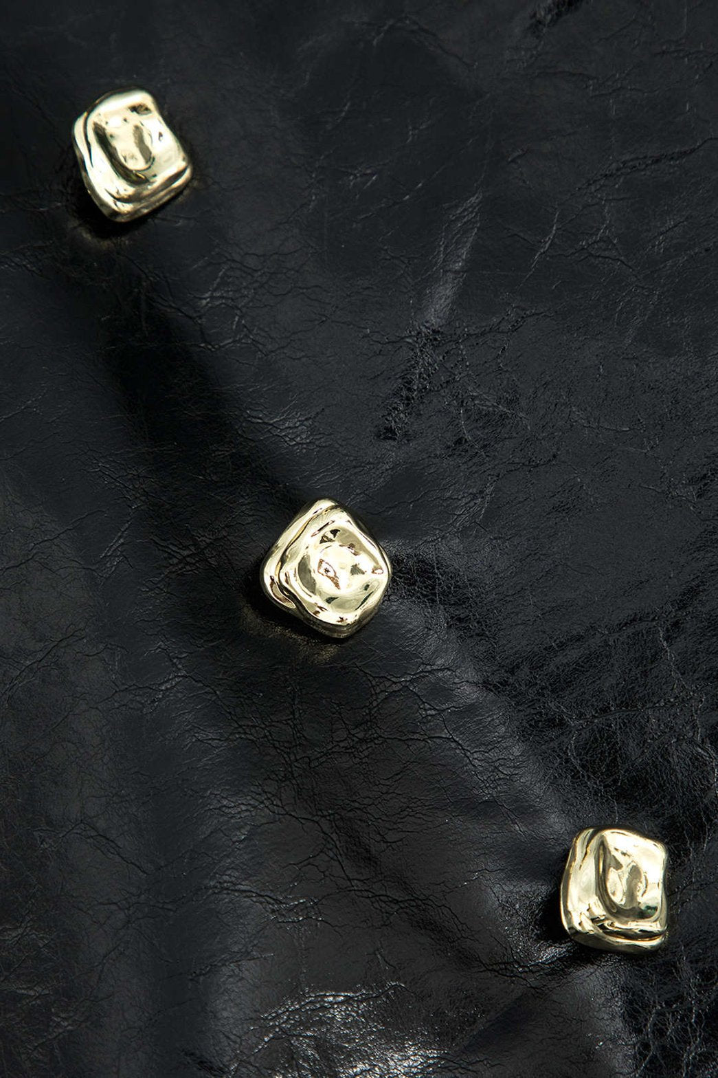 Mini-jupe noire simili cuir vue de profil soie