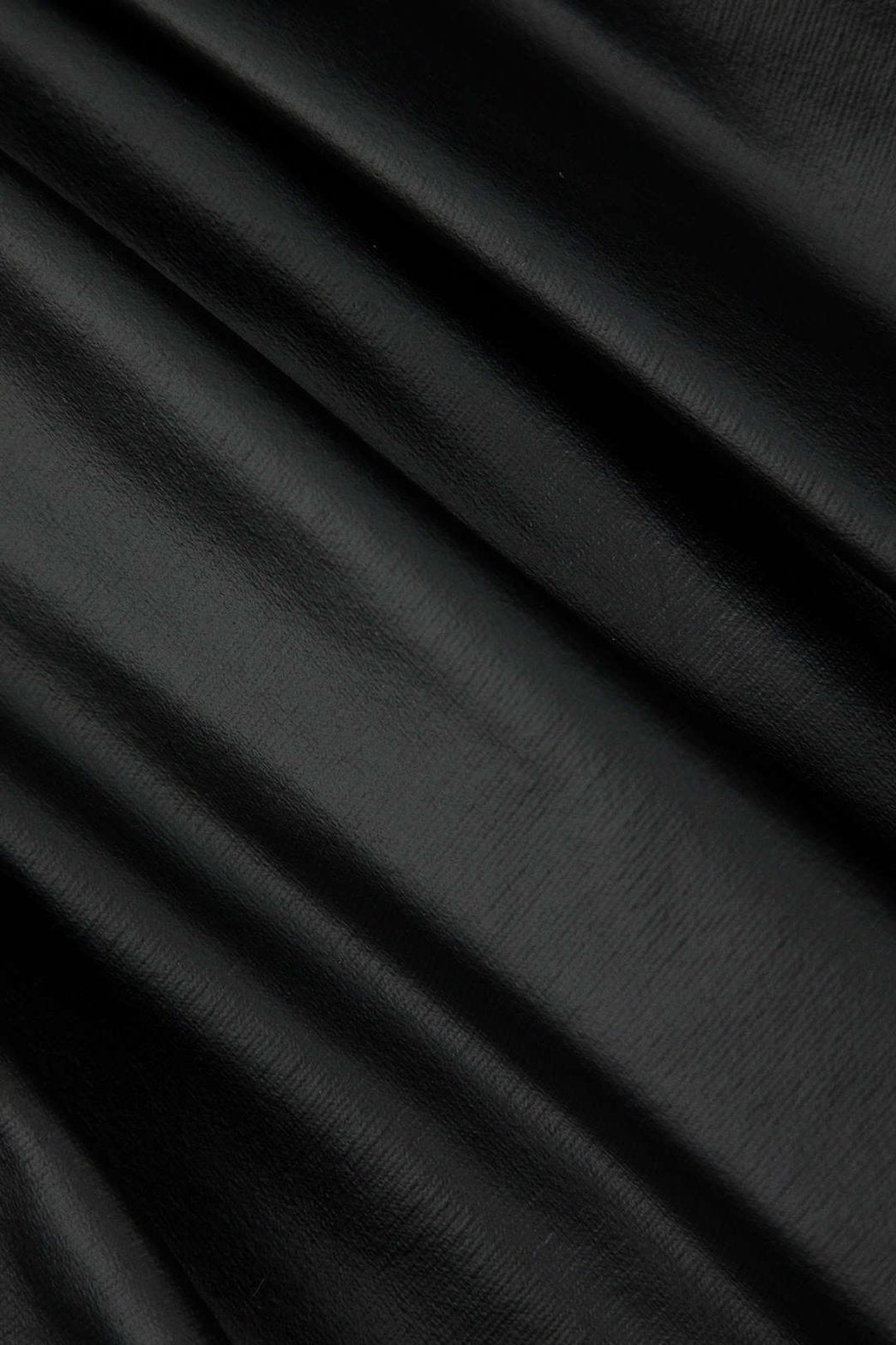 Mini jupe similicuir vue arrière vent