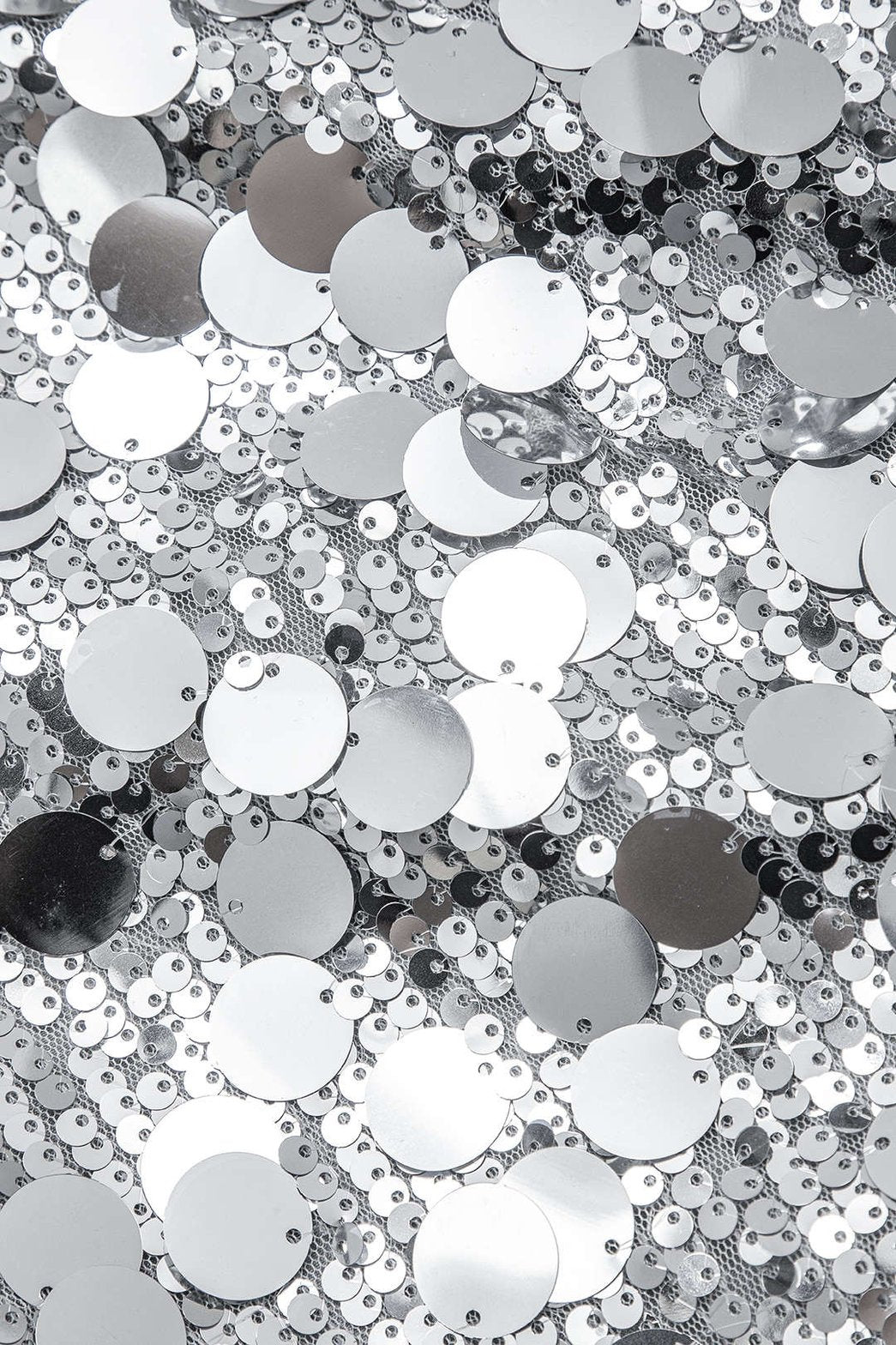 Mini-jupe pailletée argent vue de profil soleil