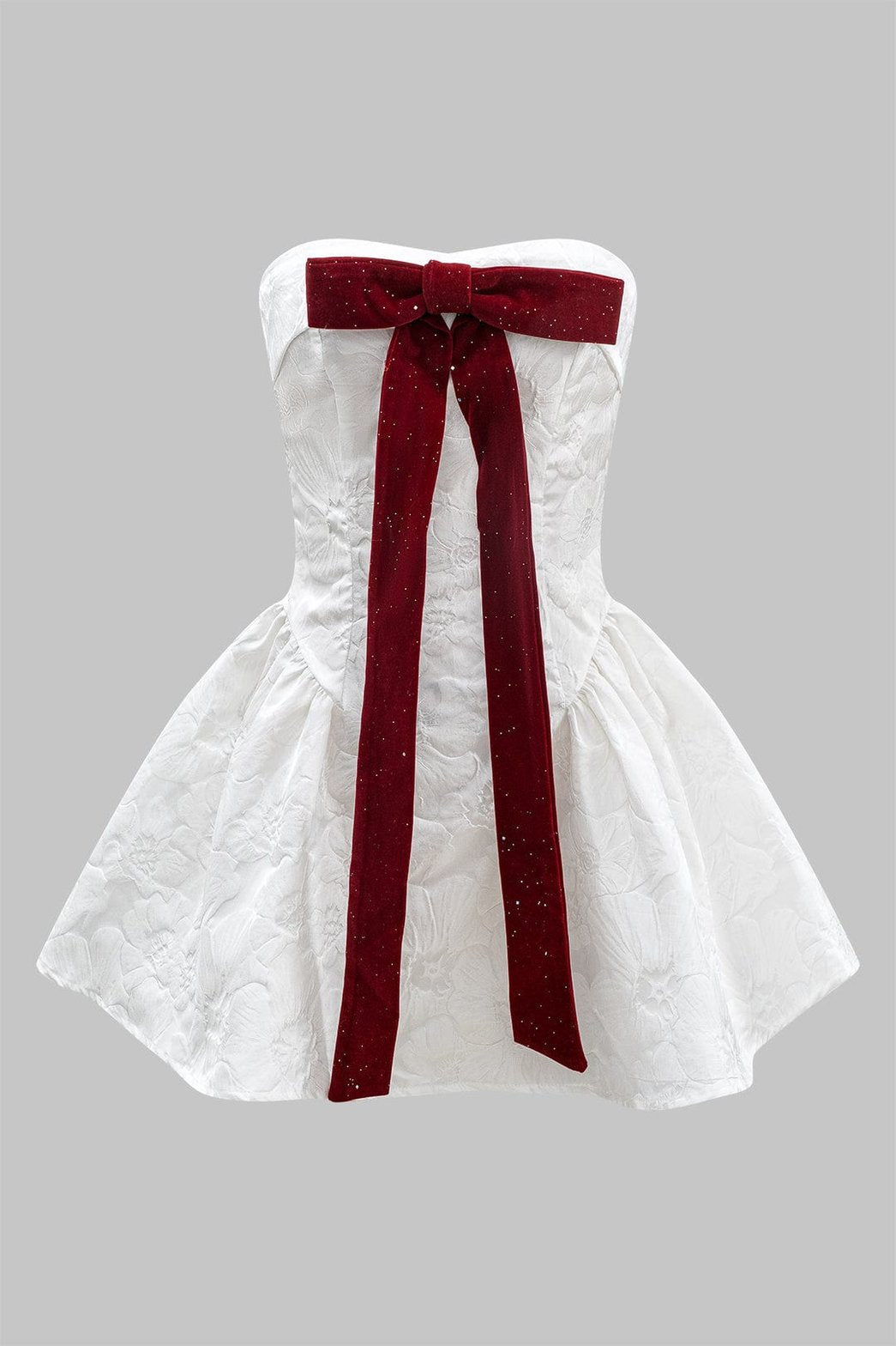 Robe bustier blanche avec nœud rouge étincelant