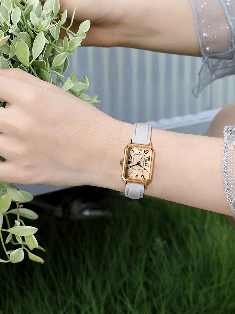 Vue latérale montre carrée or bracelet blanc - Perle