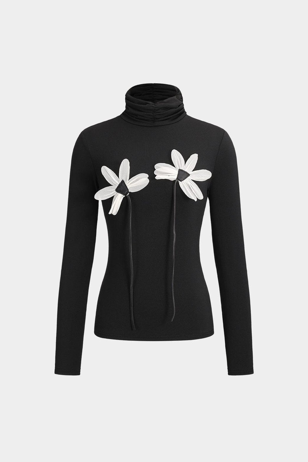 Pull col roulé noir avec appliques florales blanches harmonie