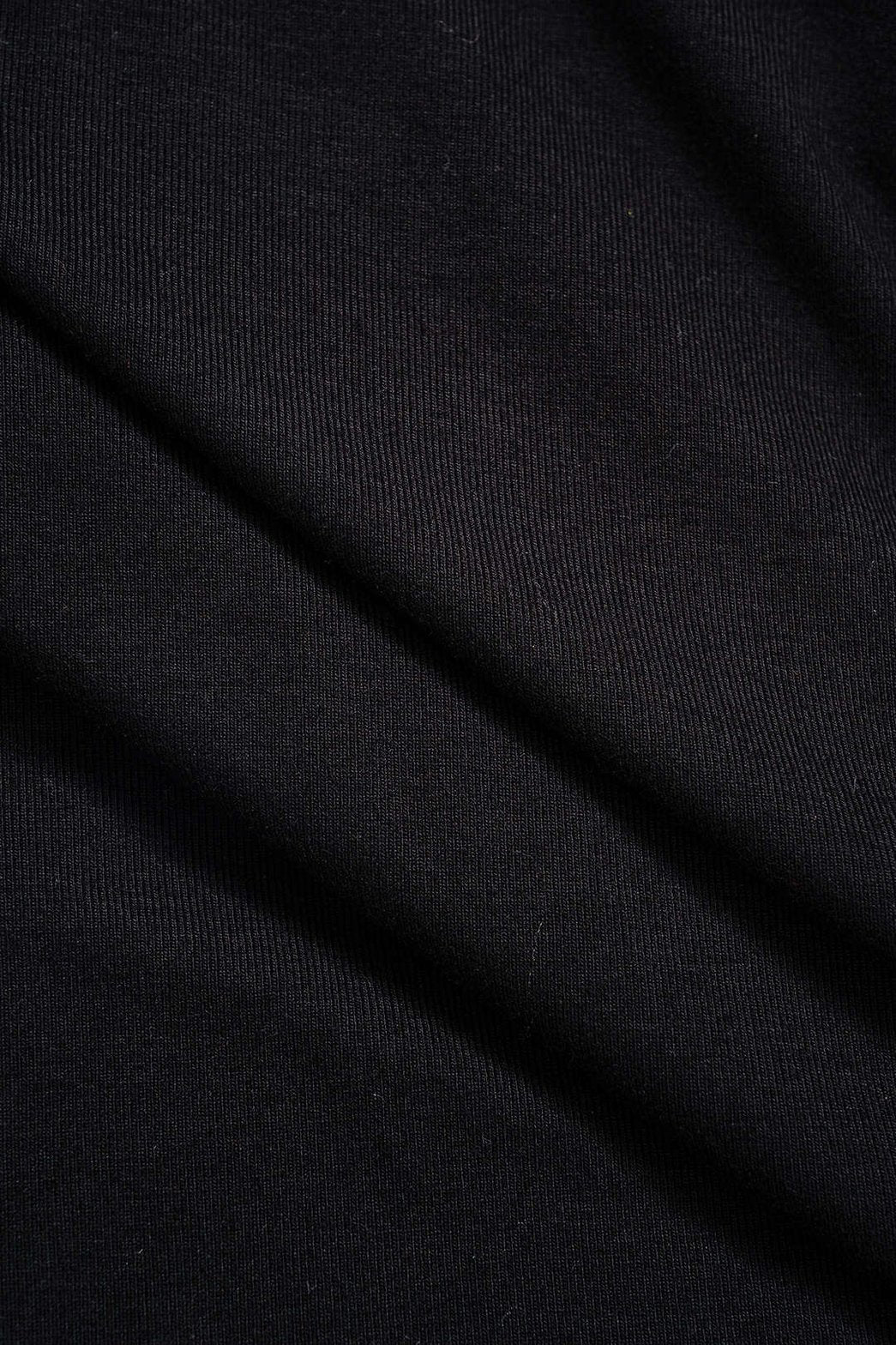 Détail robe patchwork manches longues étoile