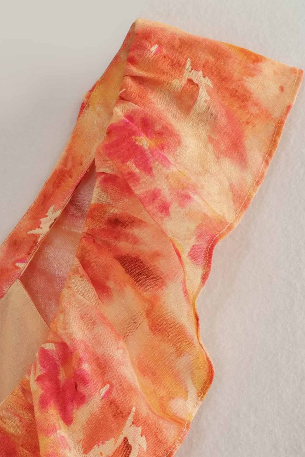 Robe longue orange détail tissu perle
