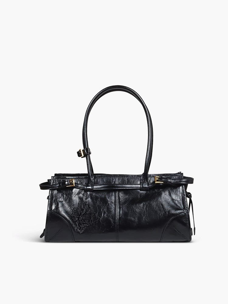 Sac à main noir avec détails dorés tendance