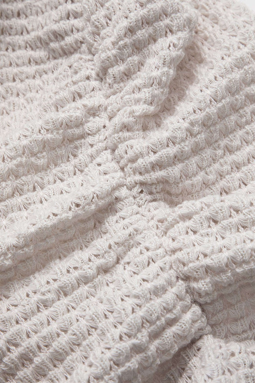 T-shirt plissé blanc détail texture grâce