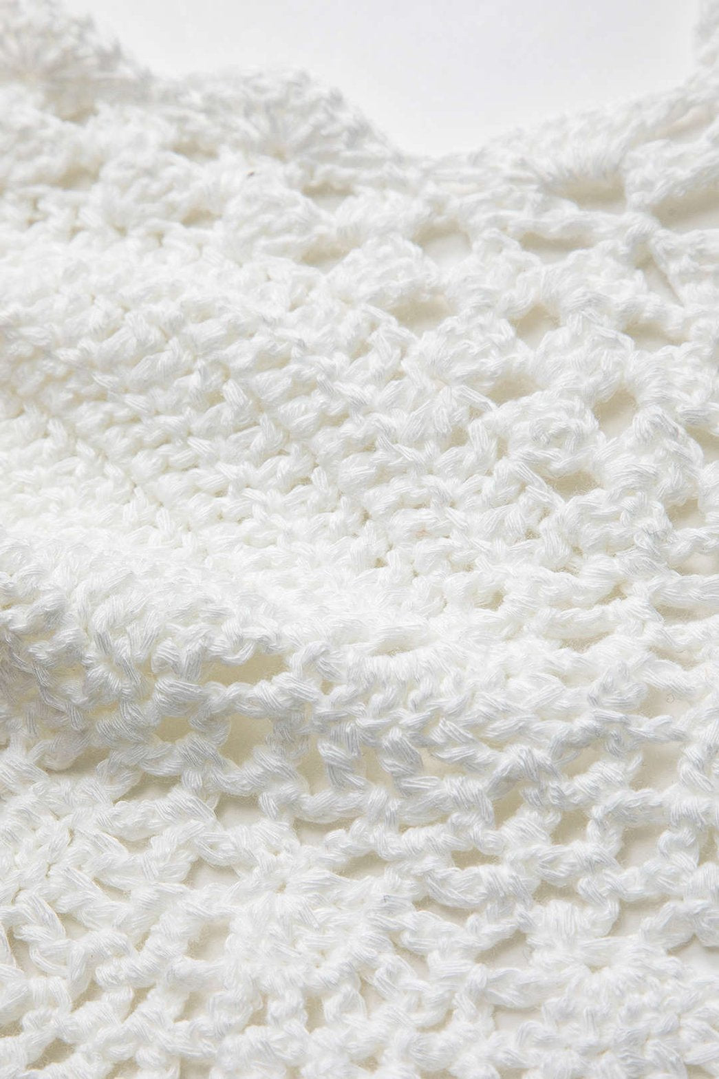 Top dos nu crocheté blanc porté été