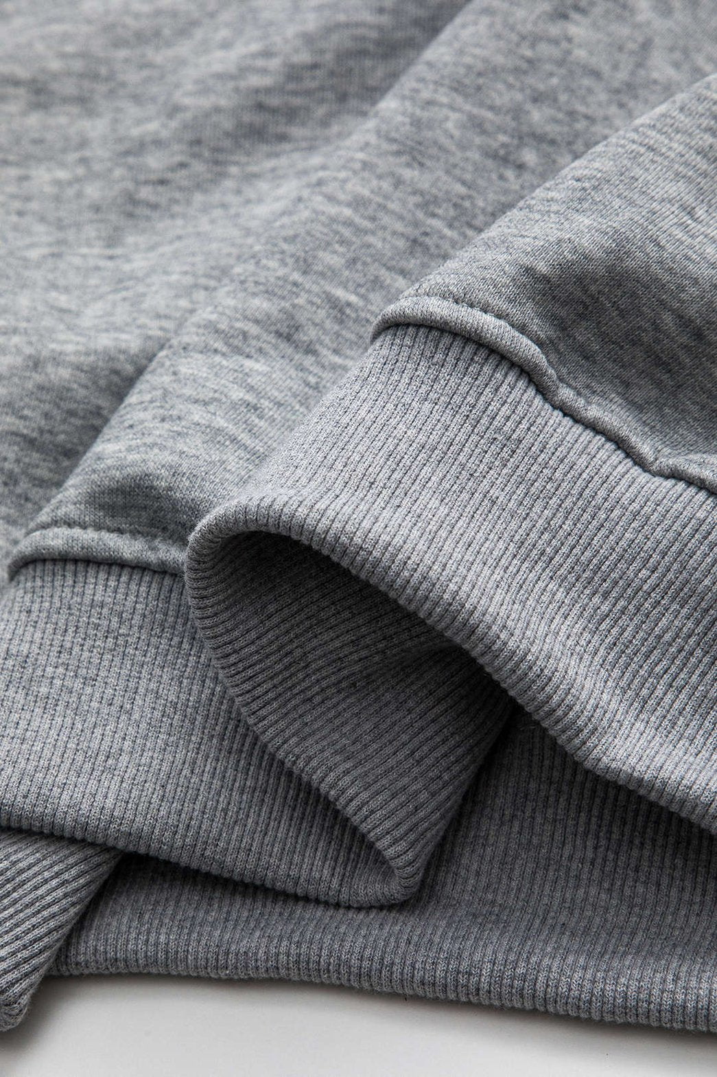 Top oversize gris à imprimé digital vue de côté étoile