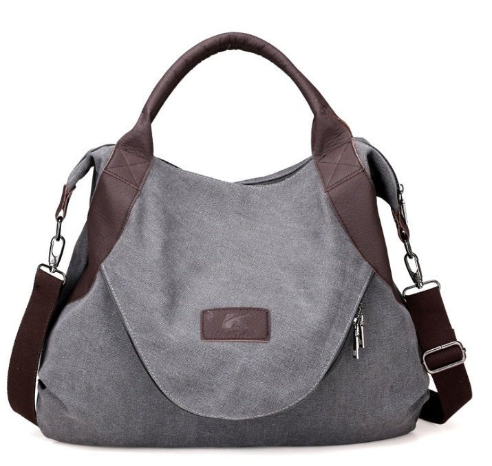 Sac hobo en toile grise et cuir marron jolieandjuliette avec bandoulière ajustable