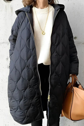 Manteau Long Matelassé à Capuche - Élégance Légère et Confort Optimal