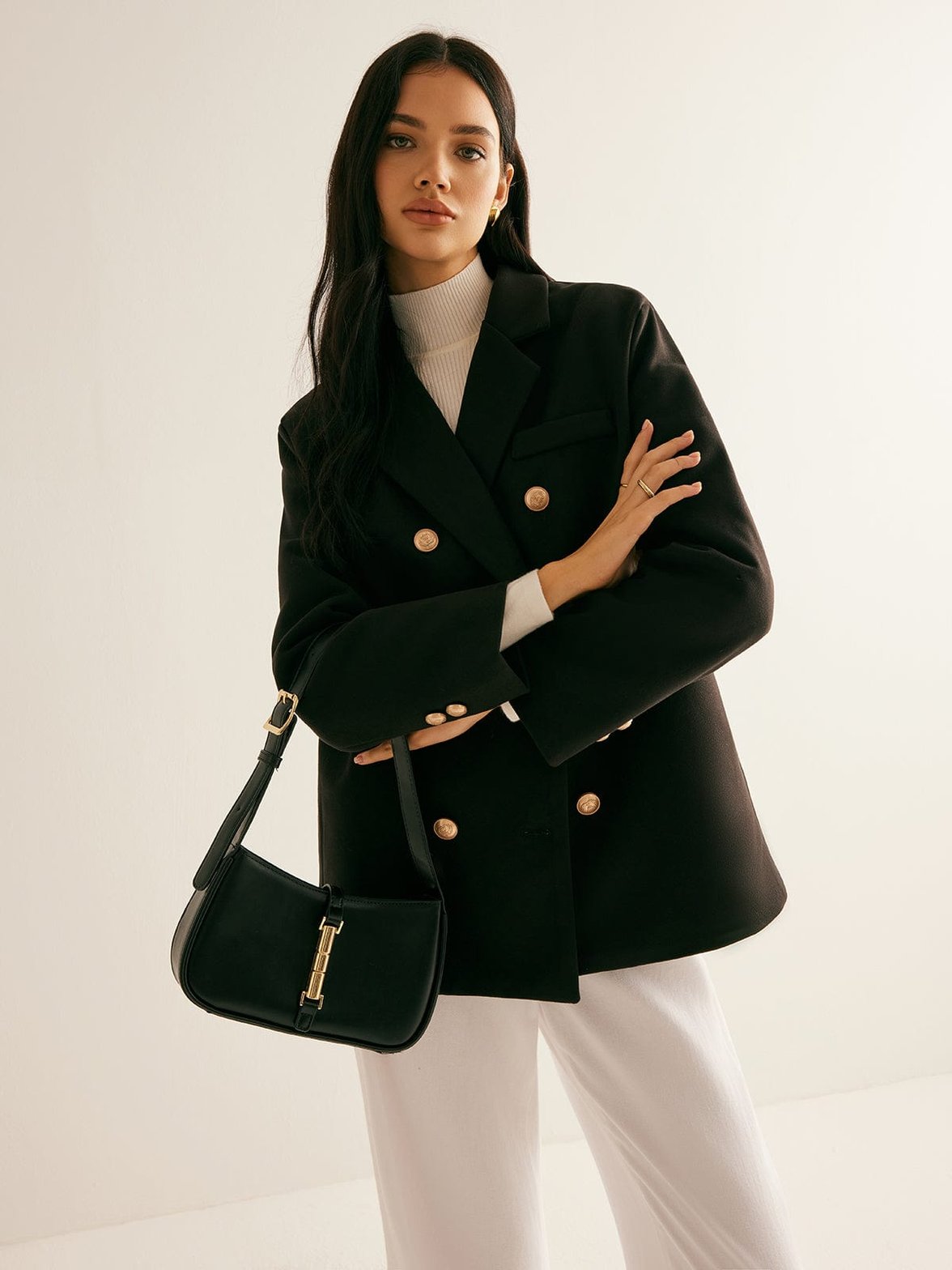 Blazer noir élégant avec boutons dorés soleil
