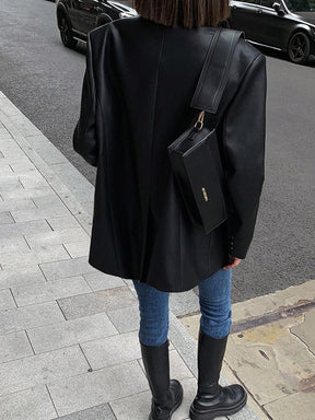 Détail couture blazer noir étoile