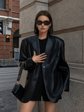 Blazer noir oversize élégant lumière