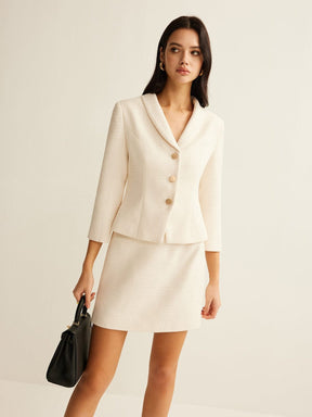 Blazer tweed beige élégant détail tissu raffinement