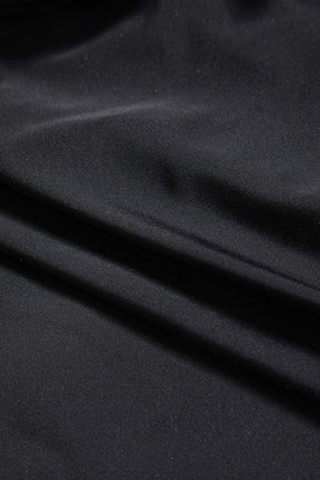 Body bustier noir porté avec jean vague