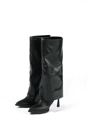 Bottes élégantes en cuir noir vue de face papillon