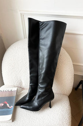 Bottes élégantes noires à talon fin douceur