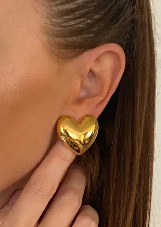 Boucles d'oreilles cœur dorées étincelant chaleur
