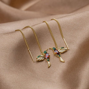 Boucles d'oreilles colibri dorées détail ailes liberté