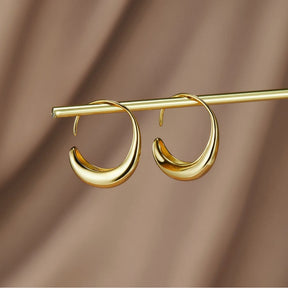 Boucles d'oreilles créoles dorées élégantes soleil