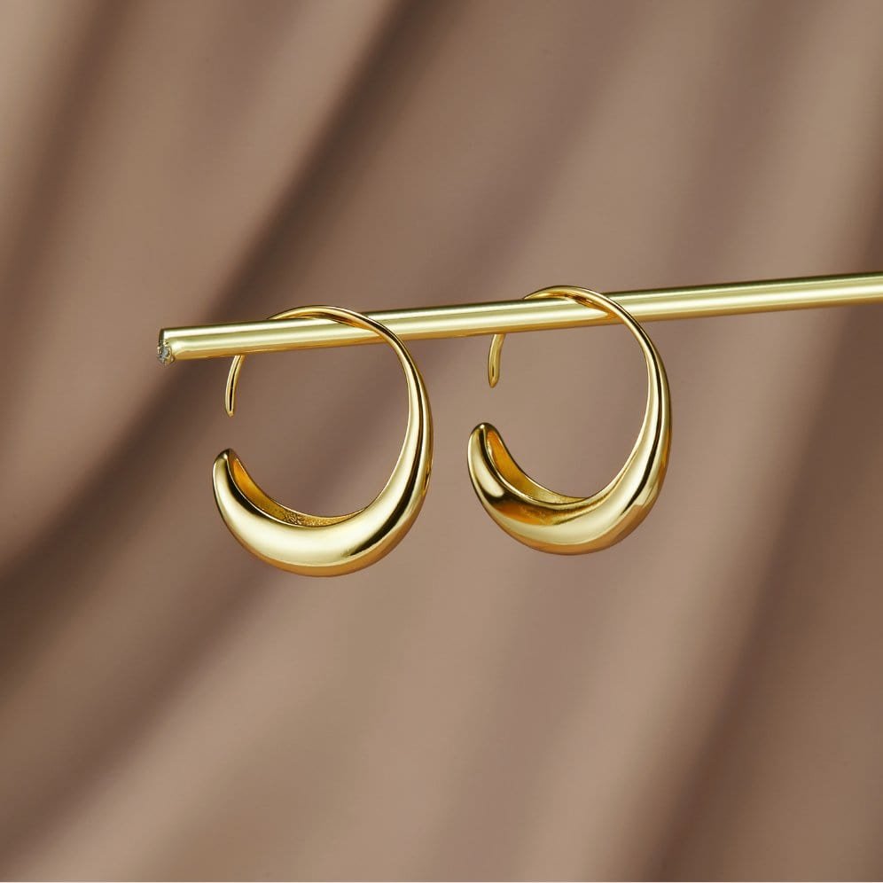 Boucles d'oreilles créoles dorées élégantes soleil
