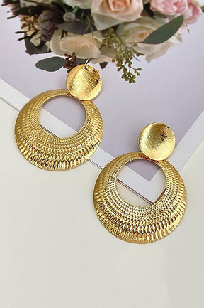 Boucles d'oreilles créoles dorées motif géométrique étoile