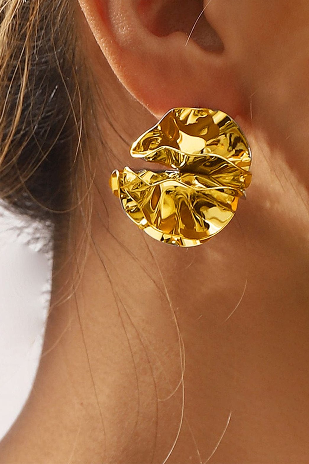 Boucles d'oreilles dorées design moderne soleil