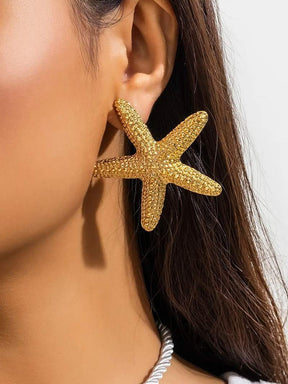 Boucles d'oreilles étoile de mer dorées étincelantes papillon