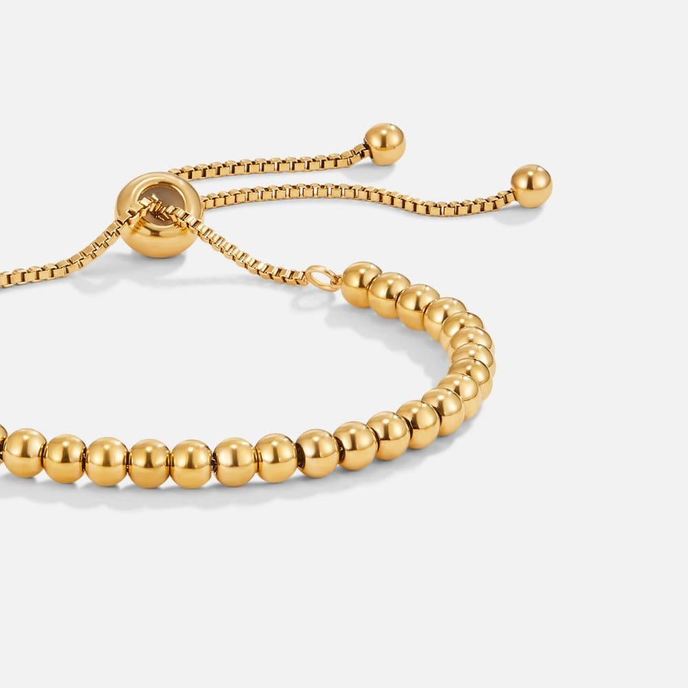 Bracelet perles dorées élégant soleil