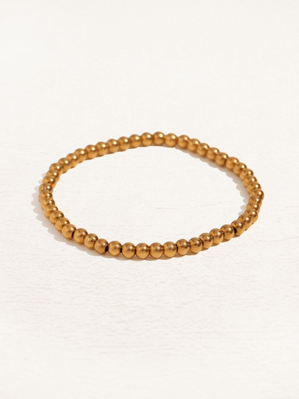 Bracelet perles or détail soleil