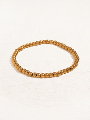 Bracelet perles or détail soleil